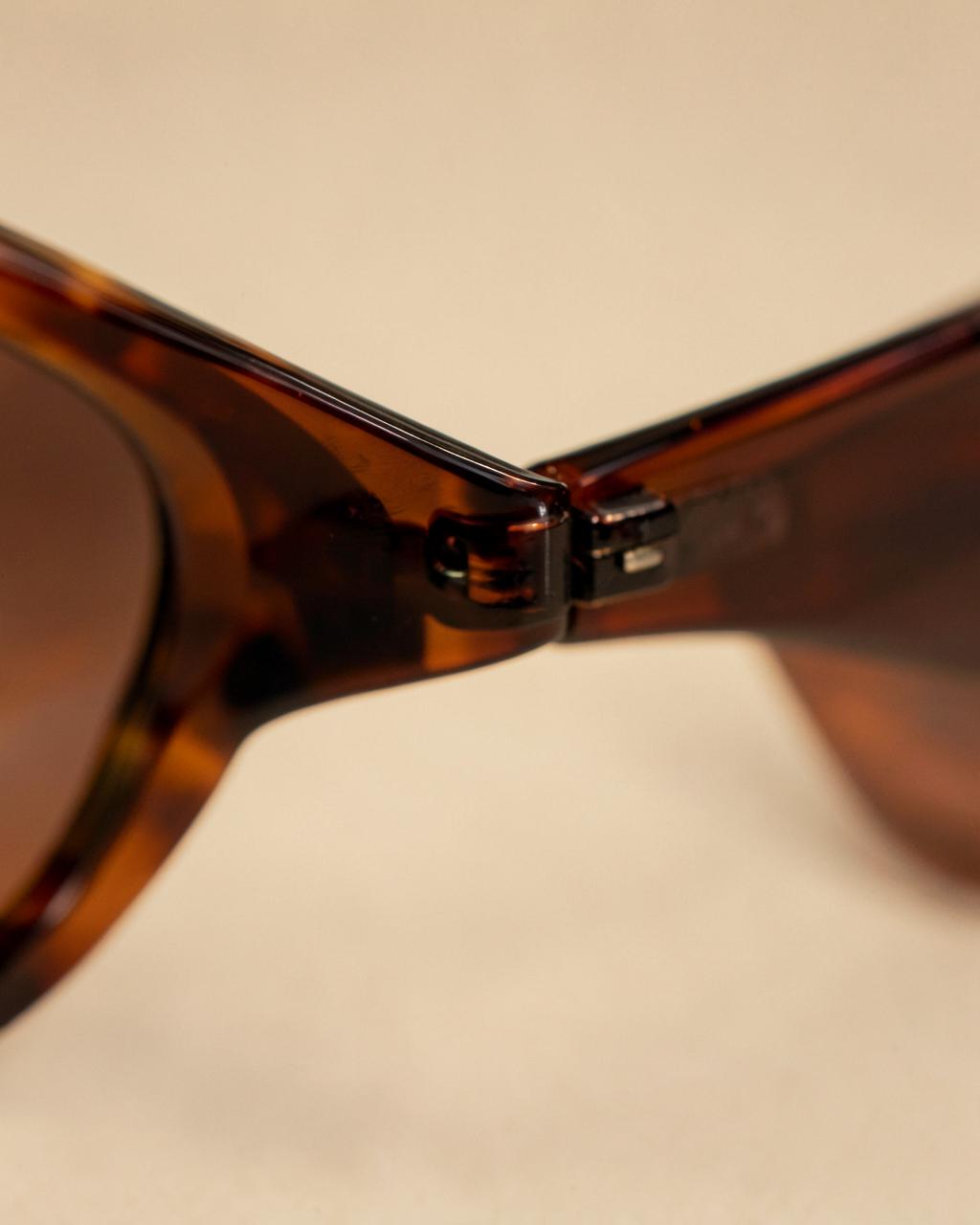 Close-up of an OLET acetate frame hinge, hand-finished detail